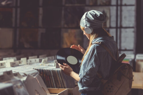 Young girl listening to music on headphones